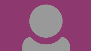 A grey person icon showing just head and shoulders with a purple background.