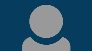 A grey person icon showing just head and shoulders with a dark blue background.