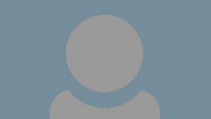A grey person icon showing just head and shoulders with a pale grey/blue background.