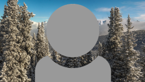 A grey person icon showing just head and shoulders with a wintery scene of pine trees background.